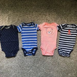 Carter’s brands onesies - 4 pack